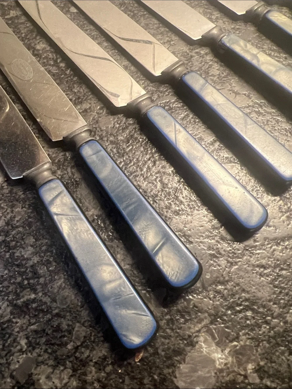 Vintage Set of 14 Peerless stainless Blue-Handled Table Knives. Iridescent